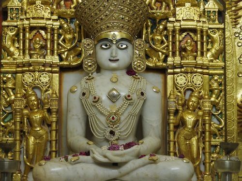 Jain Tirthankara marble statue adorned with gold and jewels